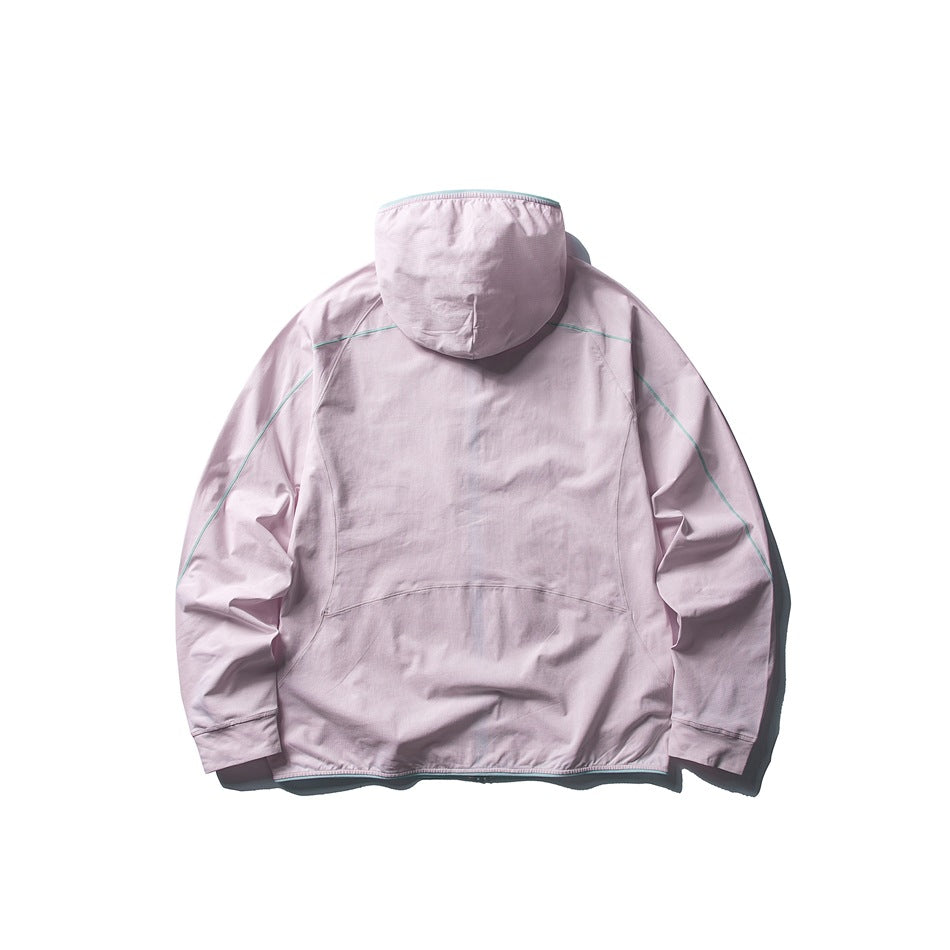 Back view of a pale lavender hooded jacket with thin mint piping across the shoulders and sleeves.