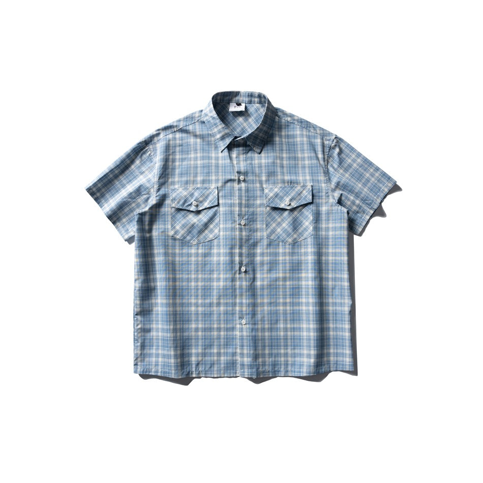 Blue and cream plaid short-sleeve button-up shirt with two chest flap pockets, flat lay front view