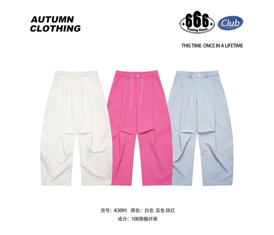 White, hot pink and light blue wide-leg drawstring pants shown side by side with a polyester composition note