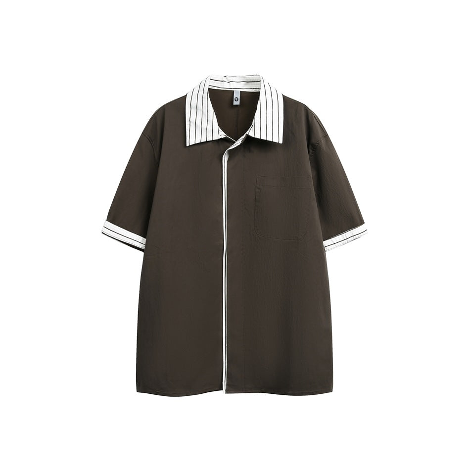 Brown short-sleeve shirt with striped white collar and cuffs, chest pocket and white-piped front placket, flat view