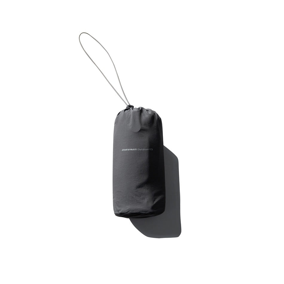 Dark charcoal drawstring storage pouch with a long cord loop, shown against white.