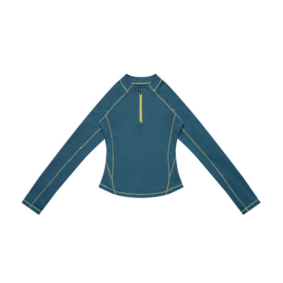 Blue long-sleeve half-zip top with yellow contrast stitching and zipper, laid flat, front view