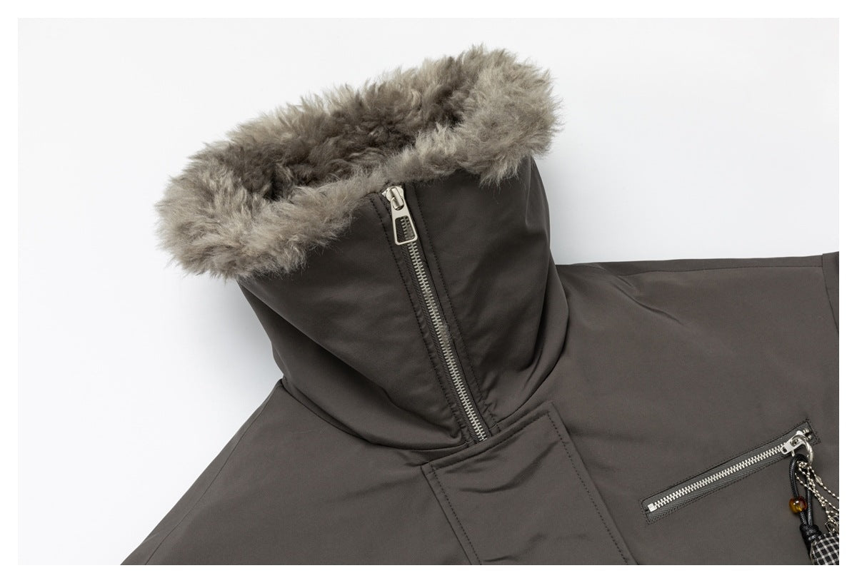 Close-up of the jacket's raised hood with gray fur trim and a silver side zipper.