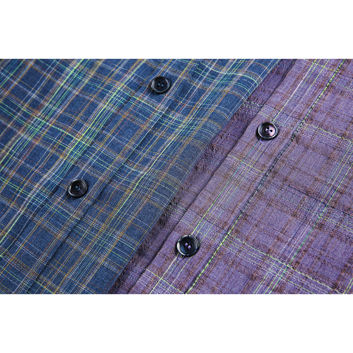 Close-up of blue and purple plaid shirt fabric with black buttons along the fronts.