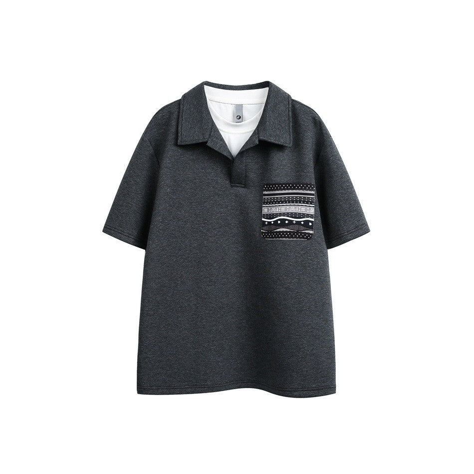 Dark heather gray short-sleeve polo-style top with white layered neckline and patterned chest pocket, flat front view