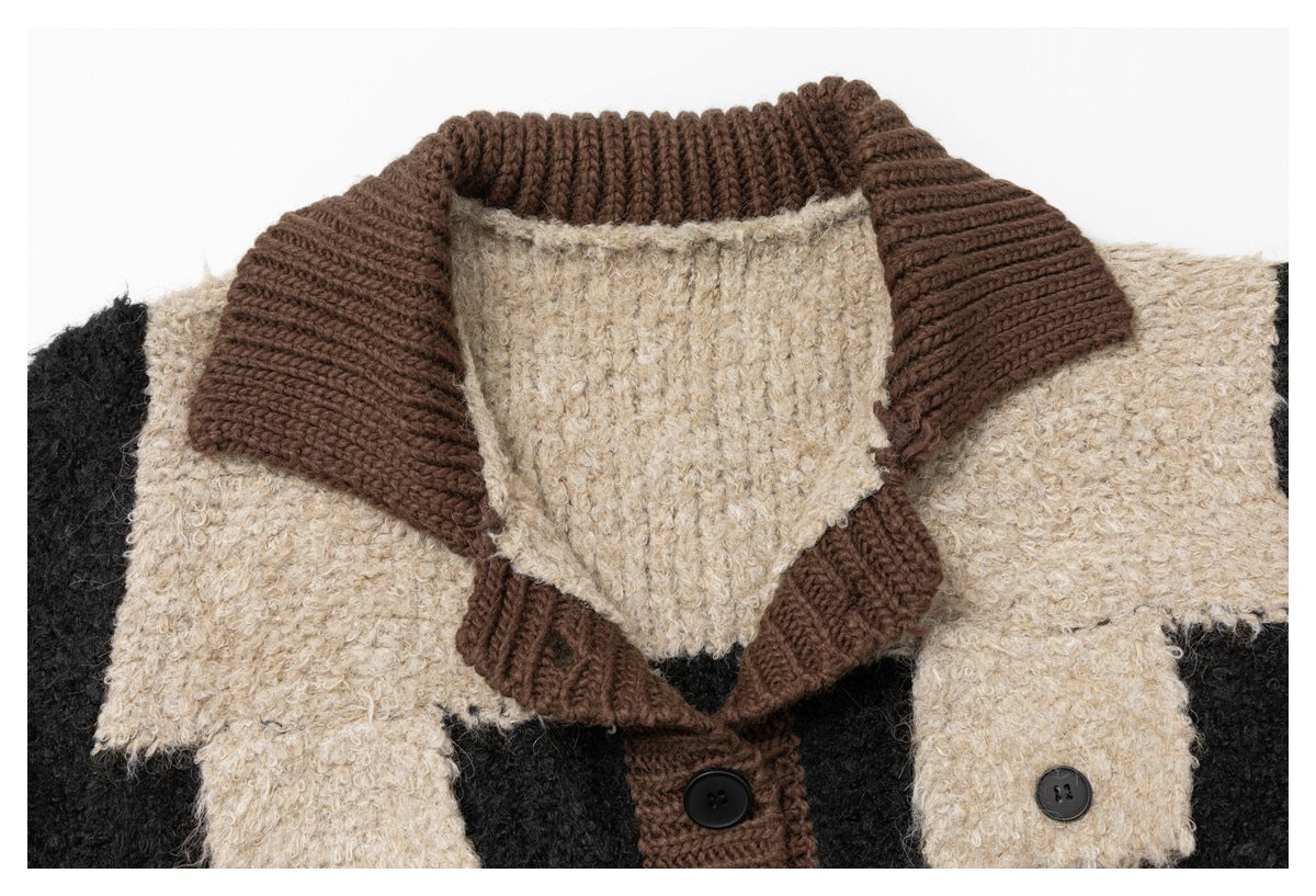 Close-up of brown ribbed collar, beige textured yoke, chest flap pocket and black buttons on a knit jacket