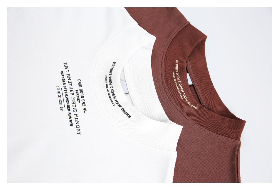 Close-up of white and burgundy T-shirt collars and chest areas with small English text prints.