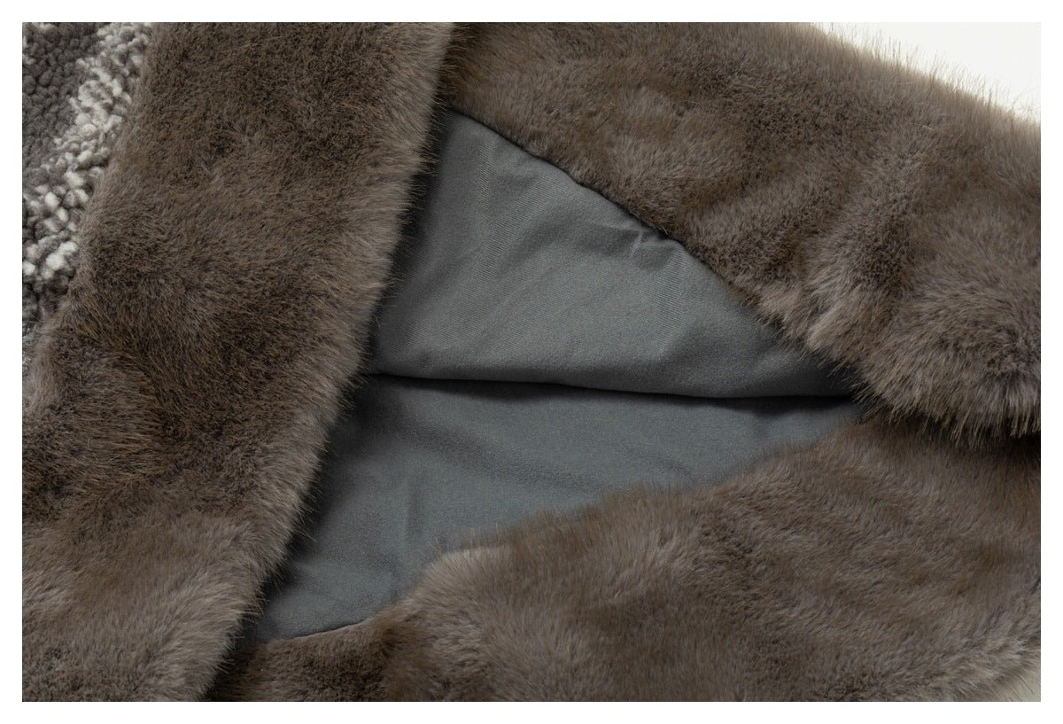 Close-up of brown fur-like trim framing a smooth gray lining, with patterned gray fabric at the edge.