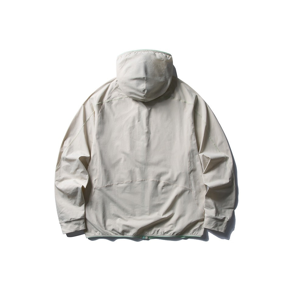 Back view of an off-white hooded jacket with subtle seam detailing and long sleeves, laid flat on white.