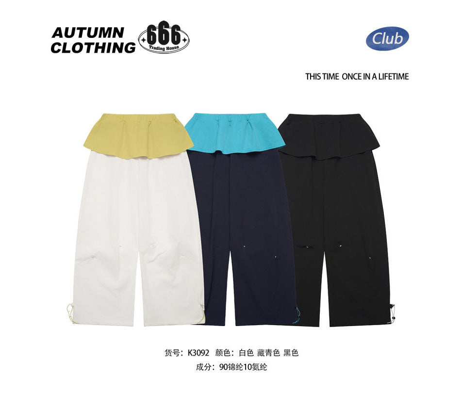 Three wide-leg flounce-waist pants in white, navy and black with a Chinese fabric composition line