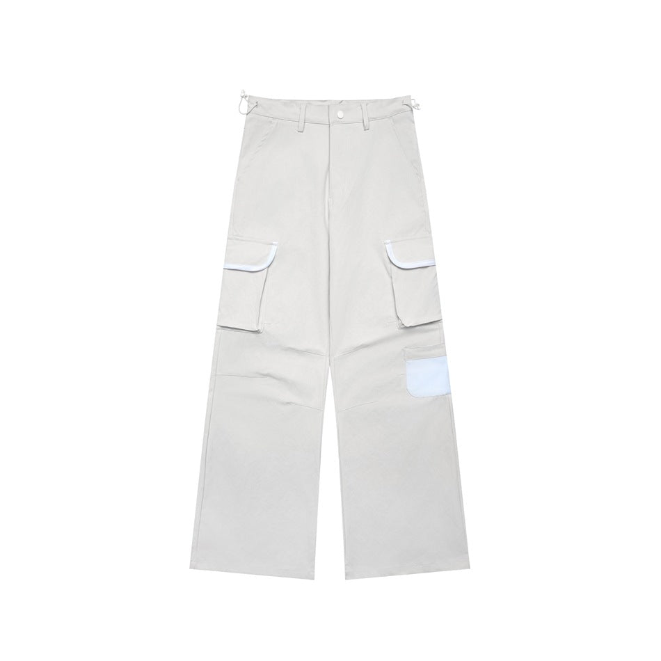 Light gray wide-leg cargo pants with white piping on flap pockets and a light blue patch pocket, shown flat
