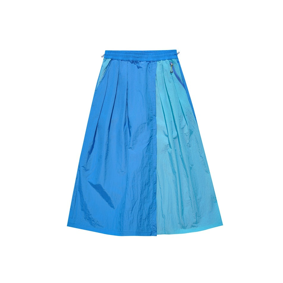Blue two-tone midi skirt flat lay with elastic waist, pleats and zippered side pocket