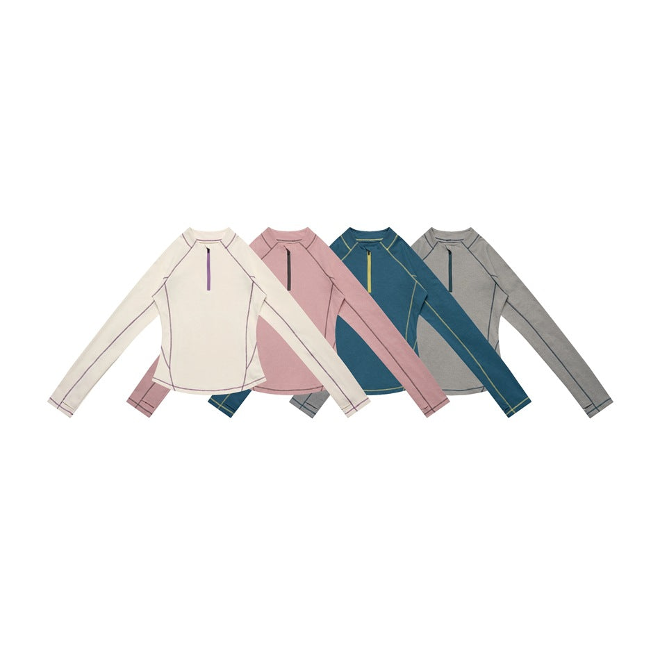 Four front-view long-sleeve tops in ivory, dusty pink, teal, and gray, shown together at a distance.