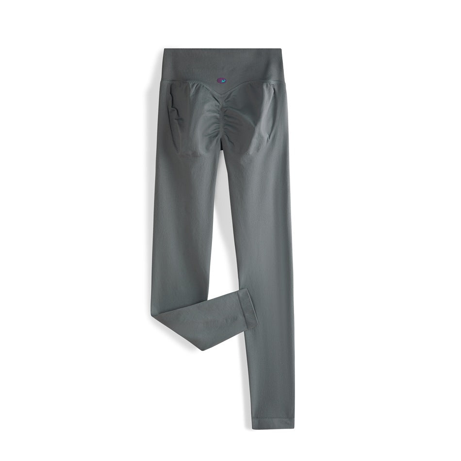 Dark charcoal high-waisted leggings shown from the back, with a ruched seat and one leg folded to show the hem.