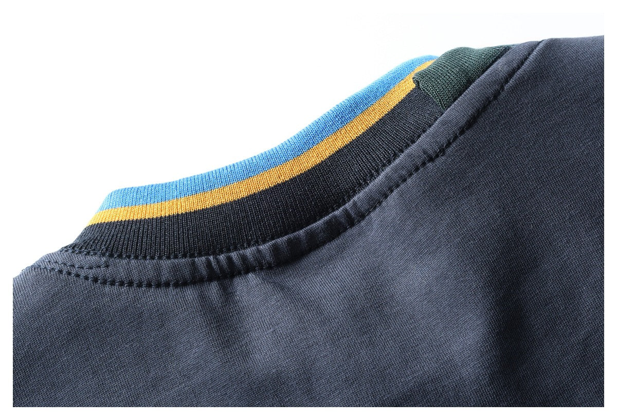 Close-up of a dark navy neckline with ribbed trim striped in blue and yellow.