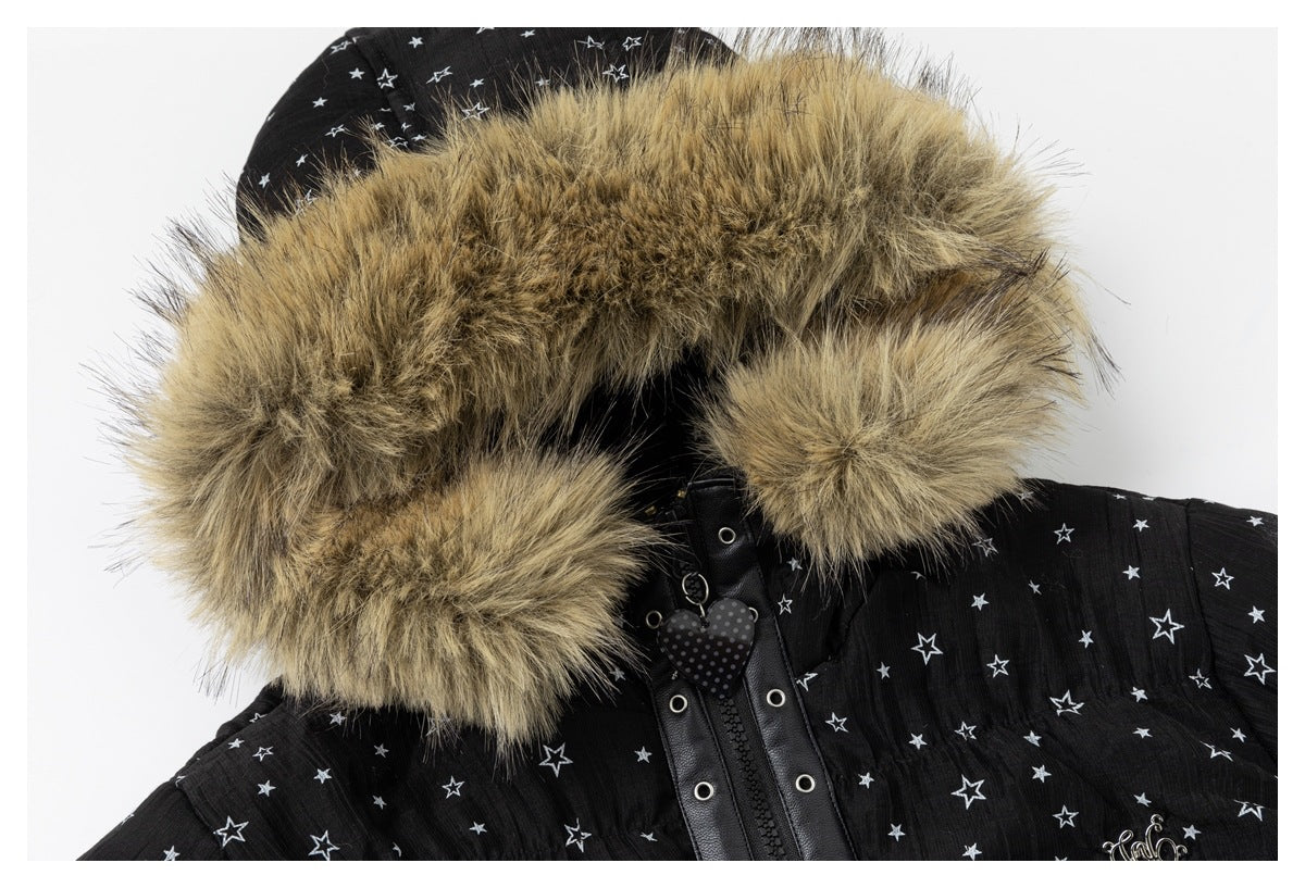 Close-up of the jacket's tan fur-trimmed hood, heart-shaped zipper charm, and star-print shoulder.
