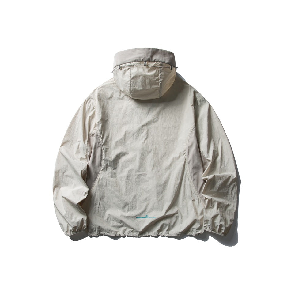 Rear view of a pale gray hooded jacket with elastic cuffs and hem, displayed flat against white.