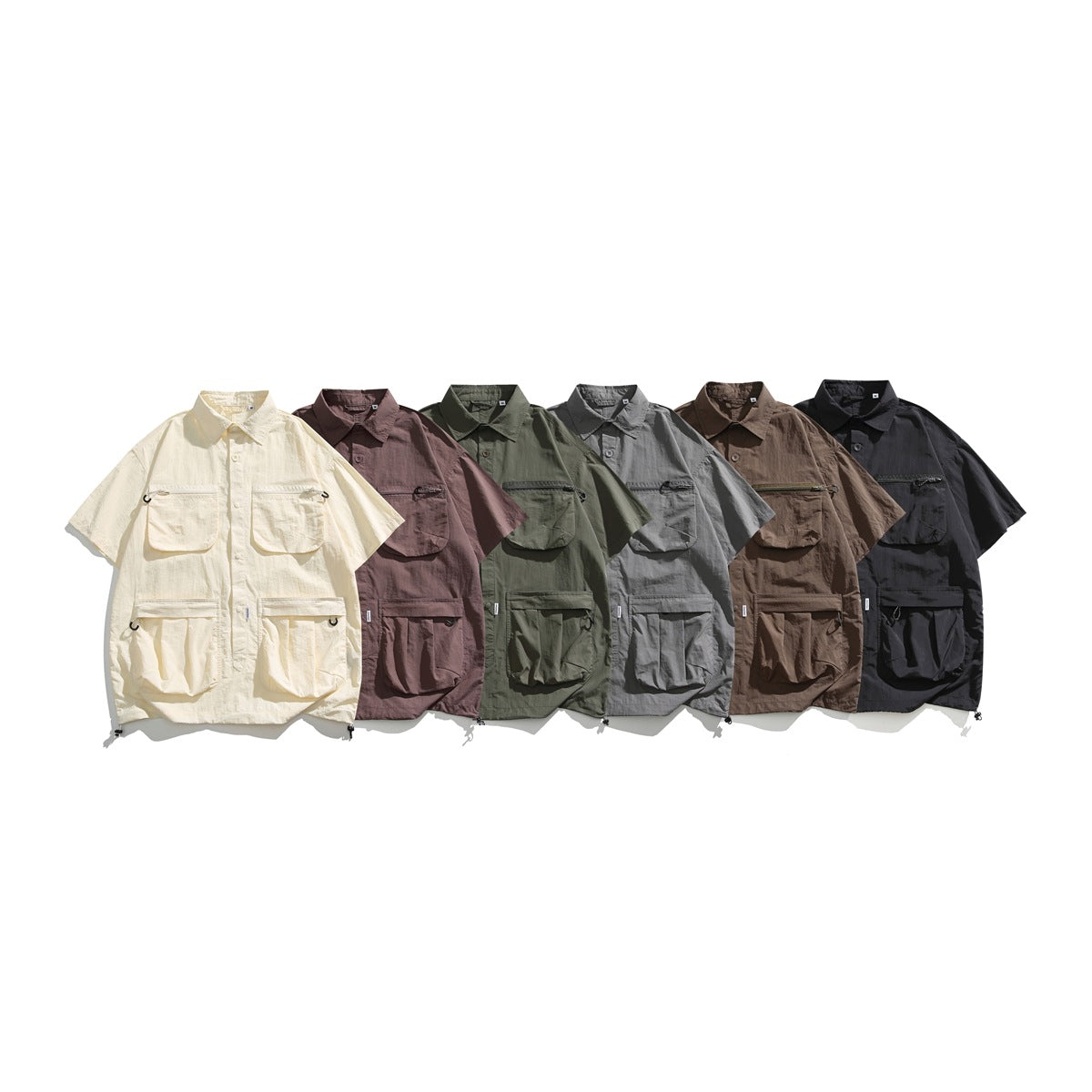 Six short-sleeve utility shirts in ivory, mauve, olive, gray, brown, and black, shown from the front.