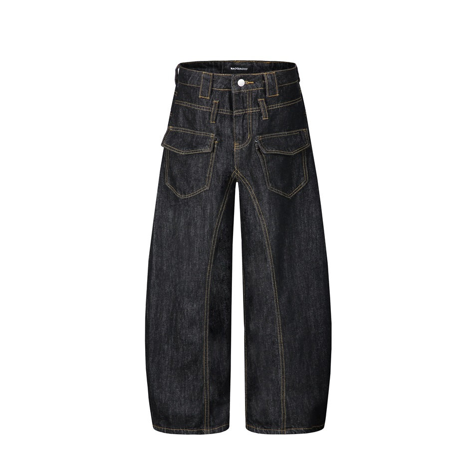 Front view of washed black wide-leg barrel jeans with flap pockets, double waistband and golden topstitching