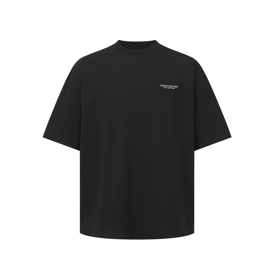 Front view of a black oversized short-sleeve T-shirt with a small white text print on the chest.