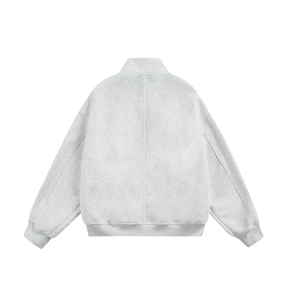 Back view of light gray stand-collar jacket flat lay with center back seam and ribbed cuffs and hem
