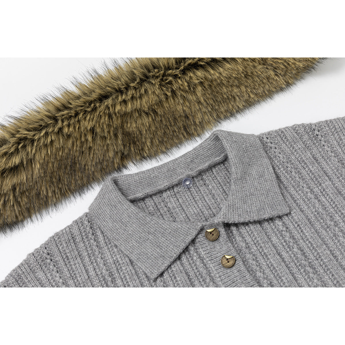 Close-up of a gray rib-knit sweater collar and buttons beside a strip of brown faux fur.