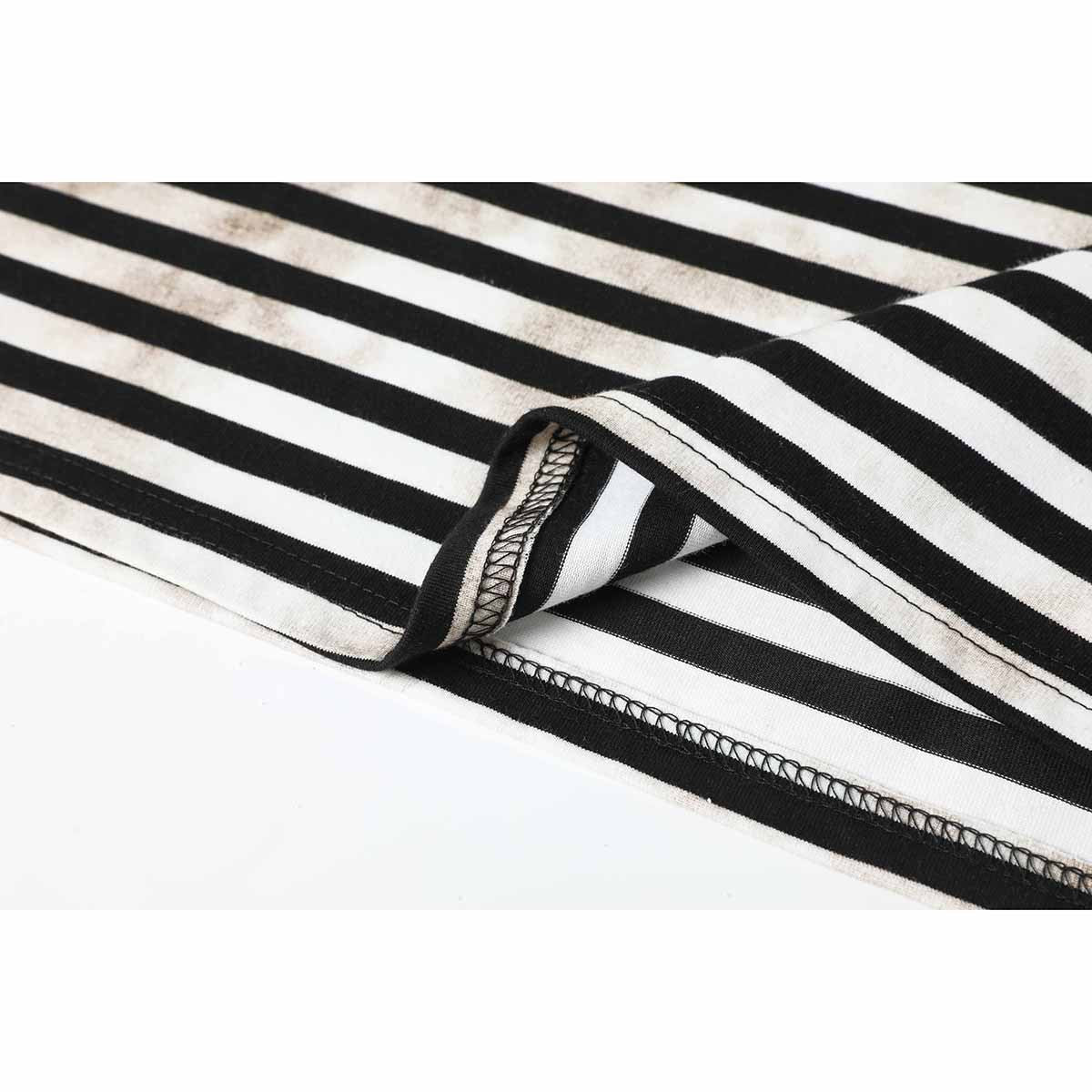 Close-up of the black-and-cream striped T-shirt hem, showing the underside and overlocked stitching.