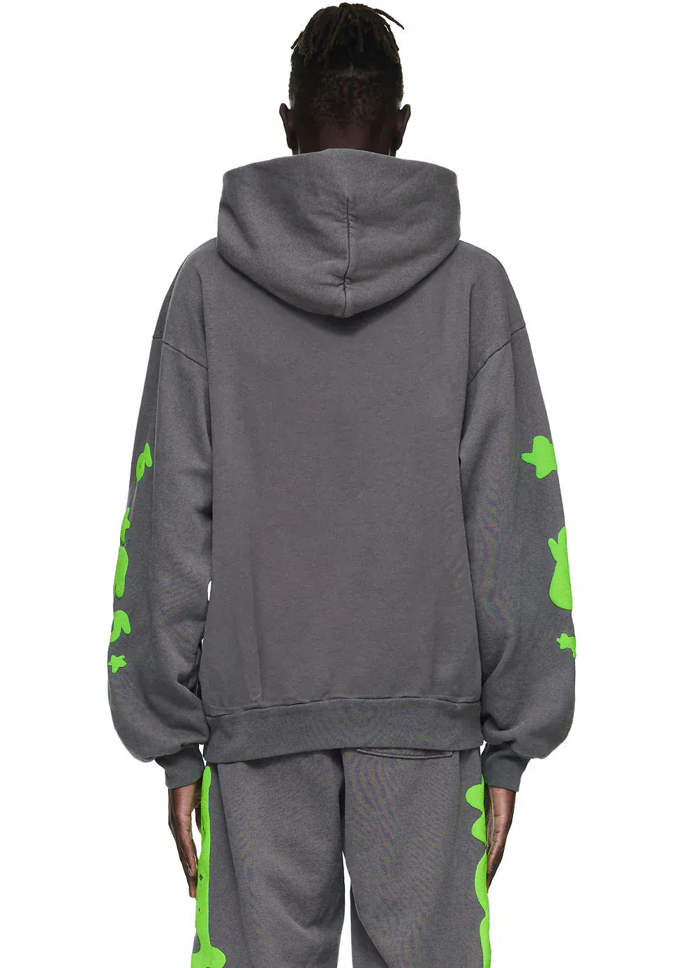 A person is seen from the back in a Sp5der 440GSM Heavyweight Hoodie – Grey & Neon Green Star Graphic Oversized Sweatshirt with matching pants, showcasing its bold streetwear style and premium fleece construction.