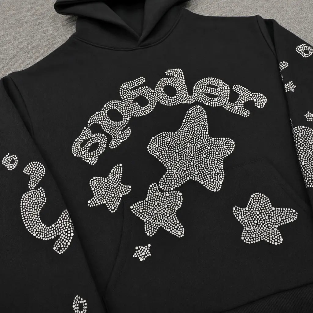 The Sp5der Black Rhinestone Star Logo Hoodie, made from 100% cotton, features sparkling rhinestone stars and "Sp5der" across the chest―a must-have black hoodie for your streetwear collection.