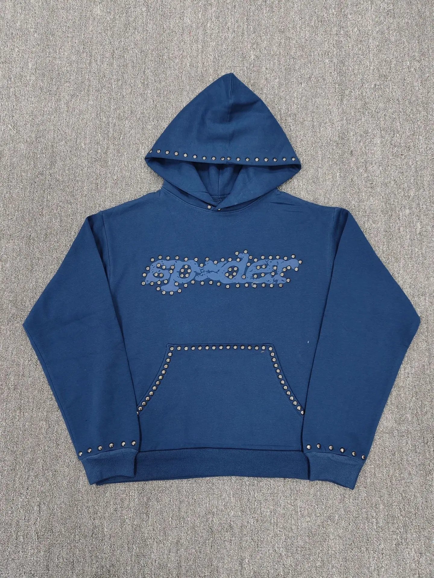 Navy blue Sp5der pullover hoodie with silver studded logo on chest and stud trim along hood, pocket, and cuffs