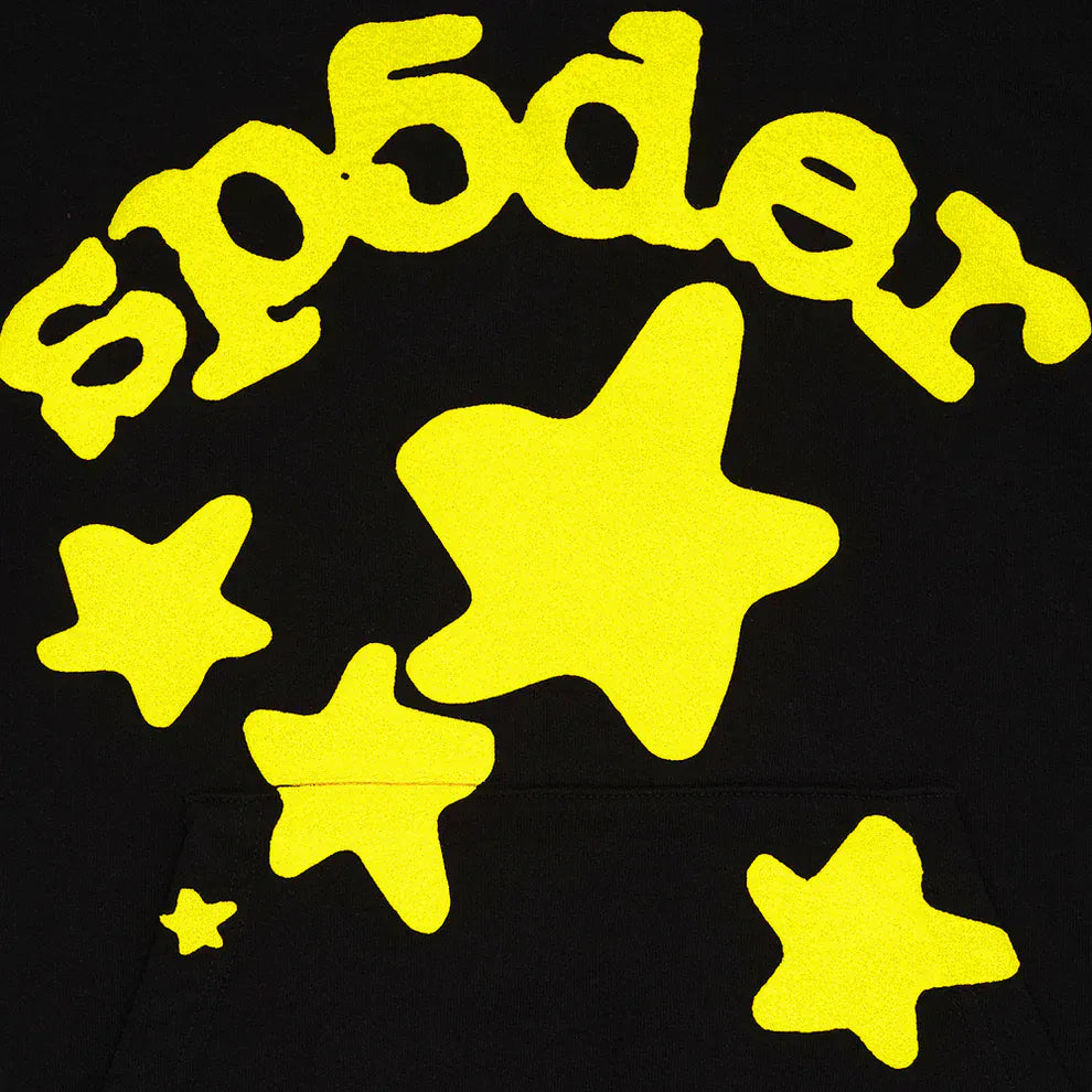 The Black and Yellow Spider Hoodie with Star Lettering Print features yellow SP5DER text and star shapes on black, offering a standout streetwear look in a comfortable pullover fit for everyday wear.