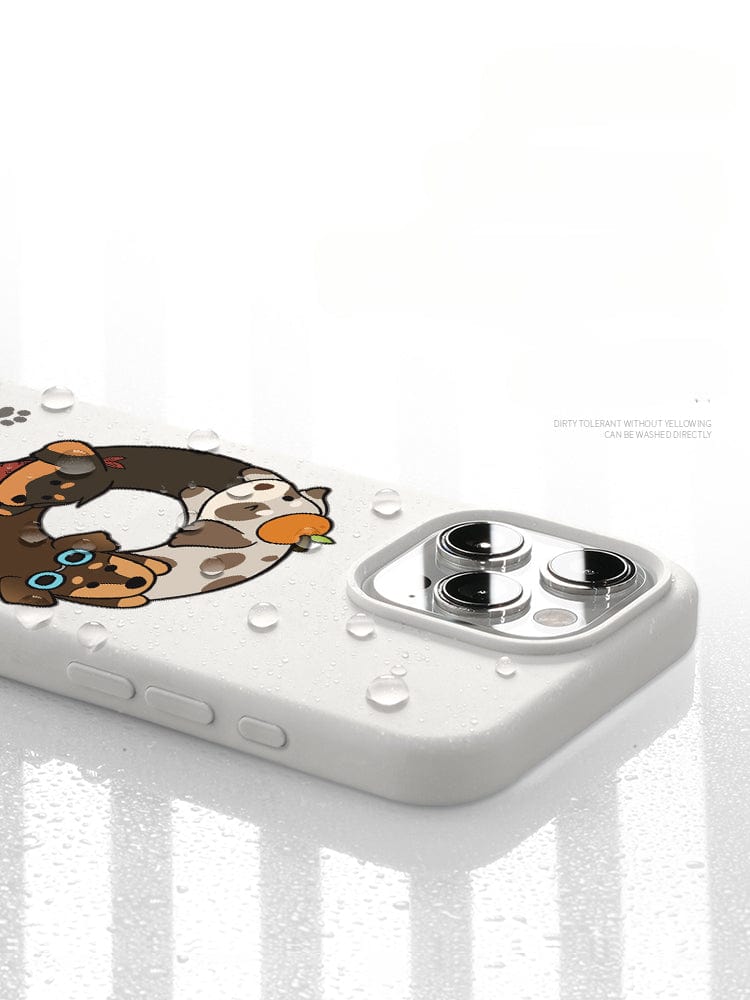The iPhone 16 Pro Max Case - Good Morning Cartoon Dog Silicone Protective Cover, featuring a charming cartoon design, lies flat with water droplets on its surface. The corner of a smartphone camera is visible. Text beside reads, "Dirty to clean without yellowing.