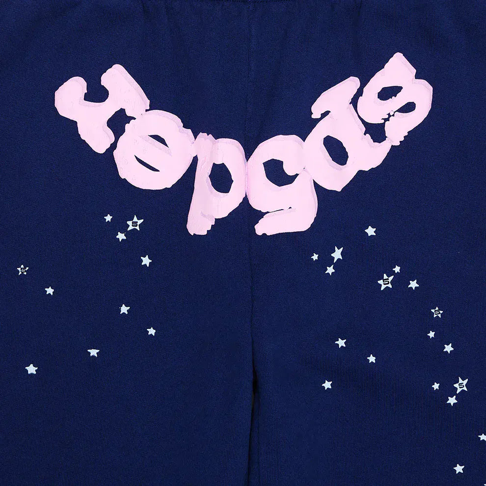 Sp5der Sweatpants – unisex navy blue cotton joggers with a pink front logo and star print, perfect for stylish streetwear fans.