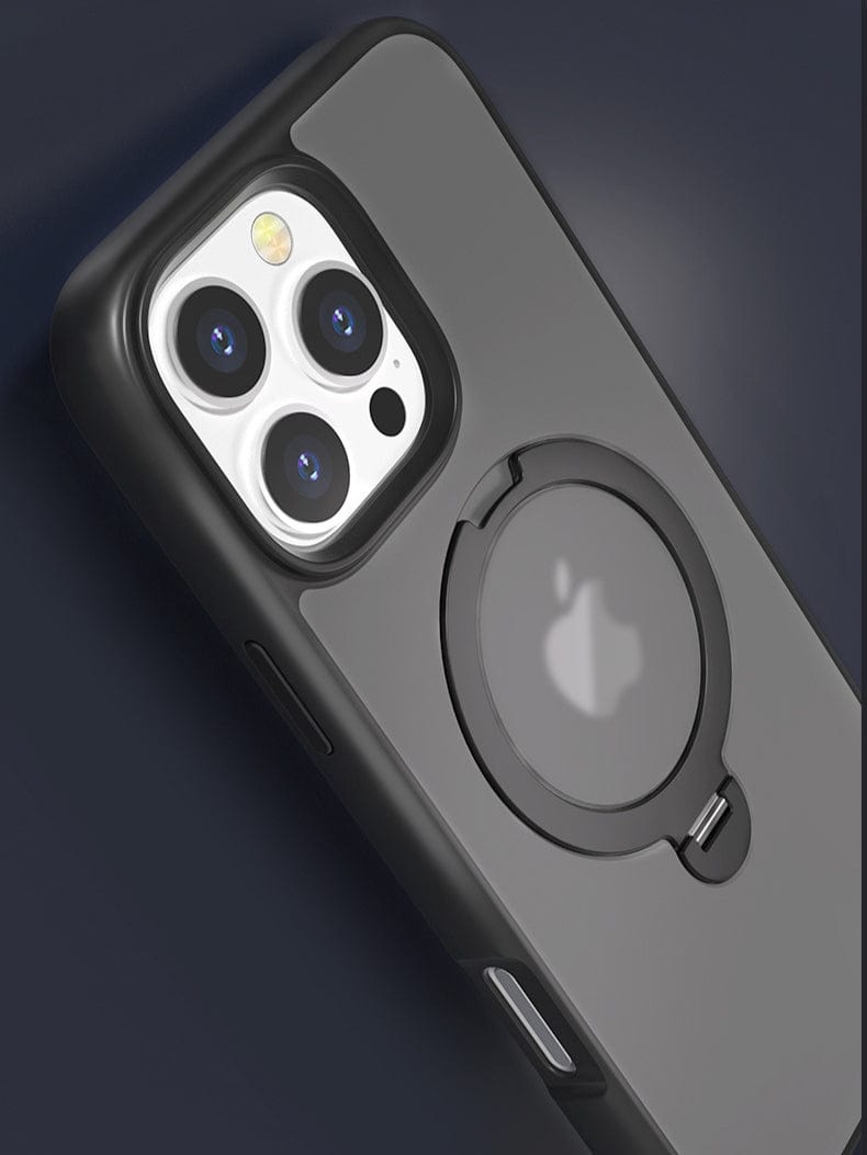 The sleek black MagSafe-Compatible iPhone 16 Pro Max Case is elegantly displayed against a dark background, highlighting its built-in circular holder that doubles as a 360° rotating stand. The design includes precise cutouts for three camera lenses and a flash, all within its slim fit and shockproof build featuring an N52 magnetic absorption and soft-touch finish.