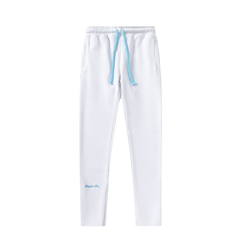 Syna World Matching Tracksuit Pants – Streetwear Jogger Pants in white feature an elastic waistband, side pockets, blue drawstring, and small blue embroidered text by the left ankle for the signature Syna World look. Available in 6 colors.