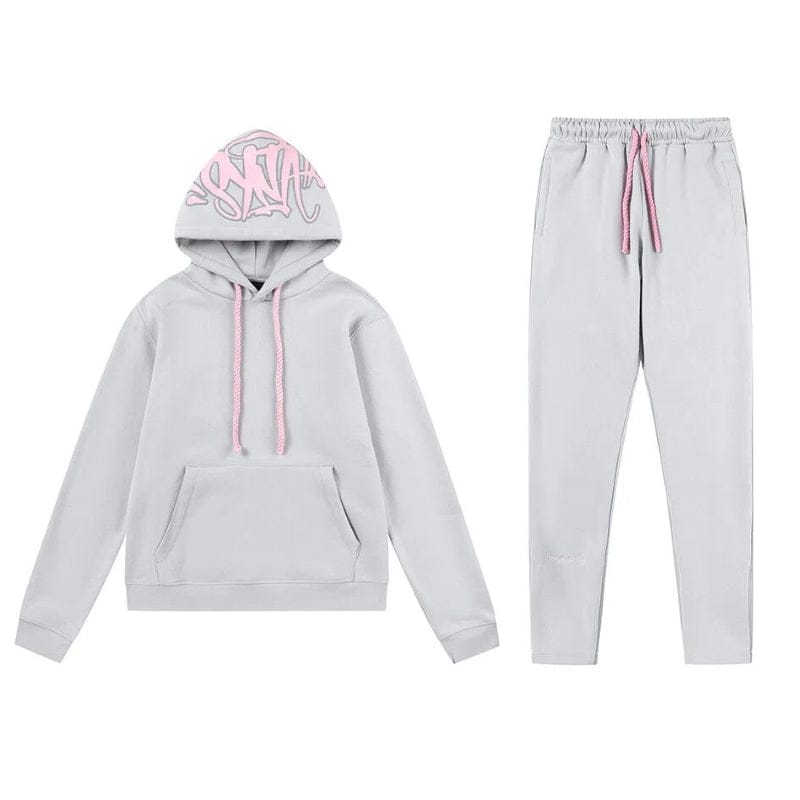 Light gray Syna World Tracksuit Set – Graphic Hoodie & Flared Pants with pink drawstrings; hoodie features a front pocket, printed hood lettering, and comes with accessories. Part of the stylish Syna collection.