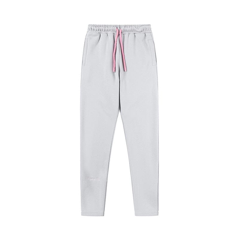 Light gray Syna World Matching Tracksuit Pants – Streetwear Jogger Pants in 6 colors, featuring an elastic waistband, side pockets, and a pink drawstring, shown on a white background.