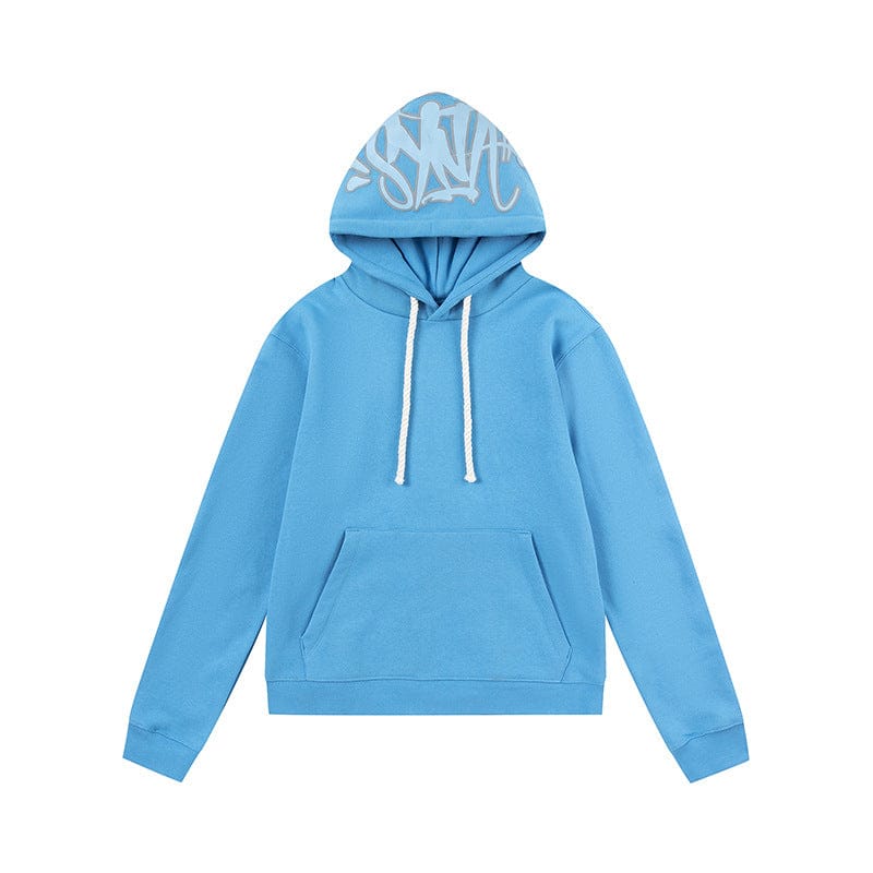 The Syna World Graphic Hoodie is a pullover streetwear hoodie in light blue with white drawstrings, a front kangaroo pocket, and bold white graffiti-style text on the hood—available in 6 colors for standout style.