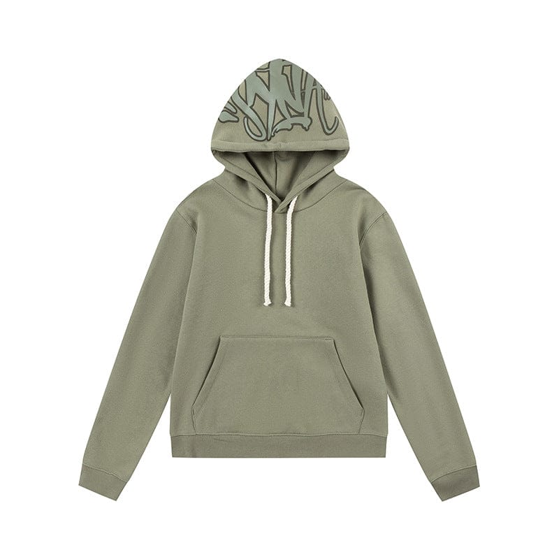The Syna World Graphic Hoodie is a pullover streetwear hoodie in light olive green, featuring a front pocket, white drawstrings, and an abstract hood design—perfect for standout urban style.