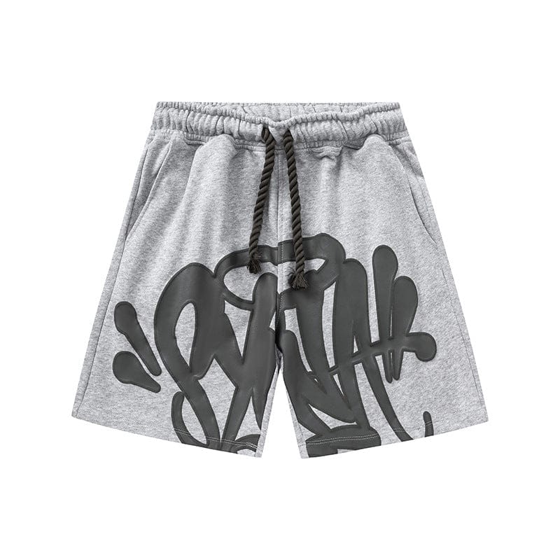 Syna World Graphic Shorts—streetwear shorts with an elastic waistband, black drawstring, and bold graffiti-style front graphic. Available in 8 colors.