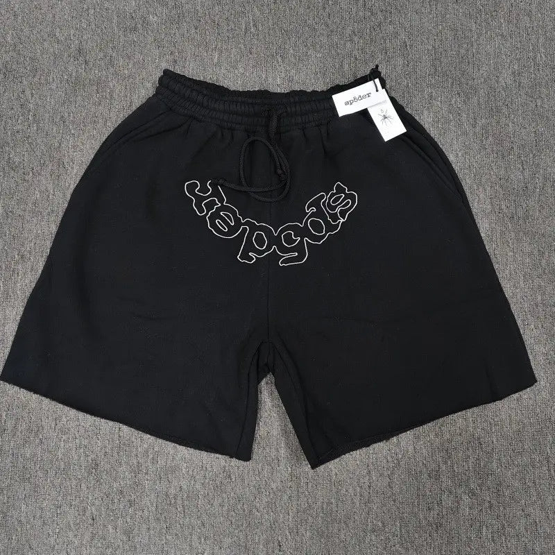 Sp5der black cotton jogger shorts with curved white outline letter graphic on the front and drawstring waistband