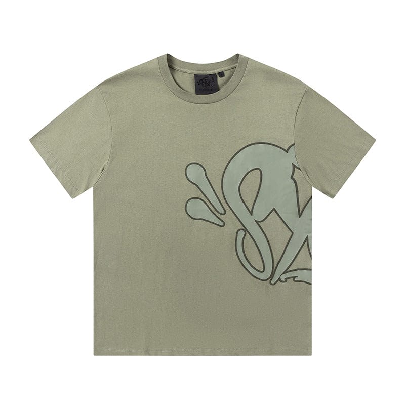 The Syna World Graphic T-Shirt is a light olive green streetwear short sleeve tee featuring a large abstract front design, partially visible on the right side. Available in 8 colors.