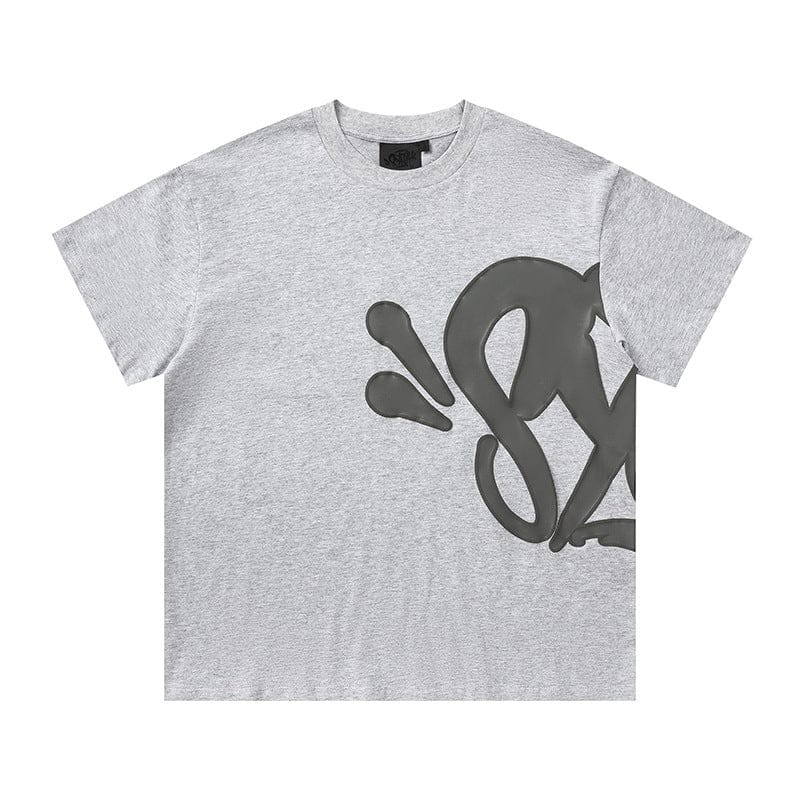 The Syna World Graphic T-Shirt is a light gray streetwear short sleeve tee featuring a bold, abstract black design on the front and left sleeve for a modern look. Available in 8 colors.